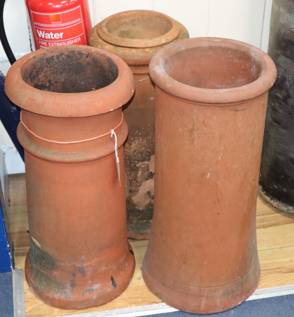 Three terracotta chimney pots, tallest 62cm